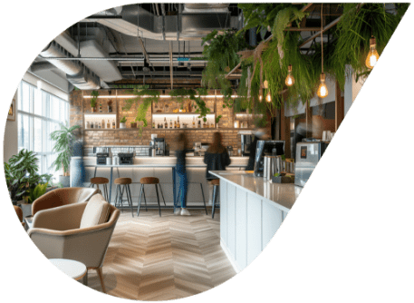 Office setup in London featuring a commercial coffee machine and seating in a droplet shape