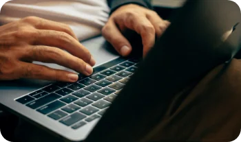 Person typing on a laptop