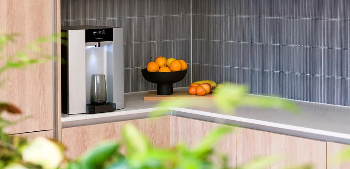 An office kitchen featuring a Borg & Overstrom water dispenser