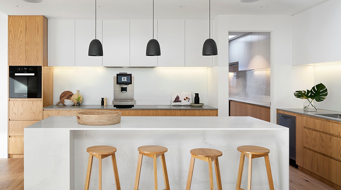 A white office setup featuring a Bestir Commercial Coffee Machine